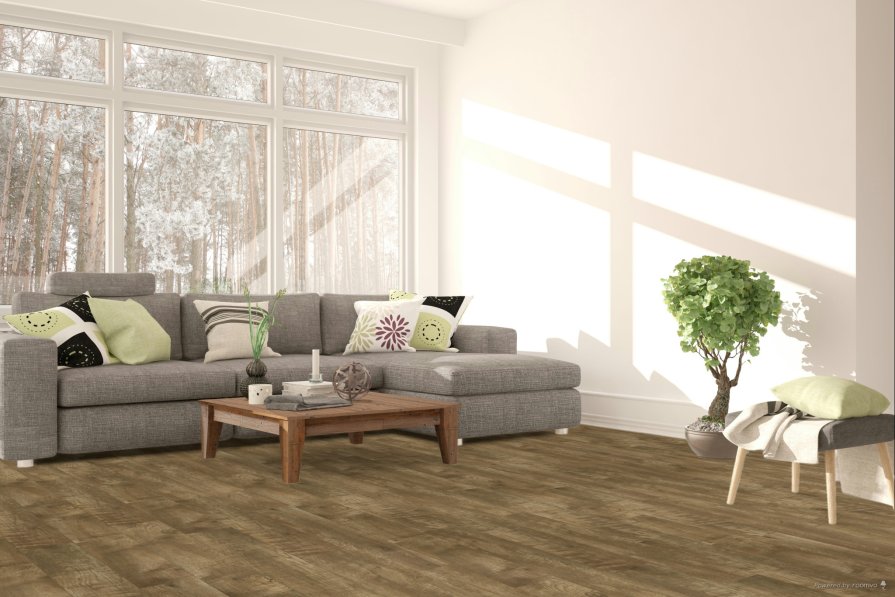Living room with luxury vinyl plank flooring featuring a warm wood look, paired with a gray sectional sofa, wood coffee table, and natural light from large windows.